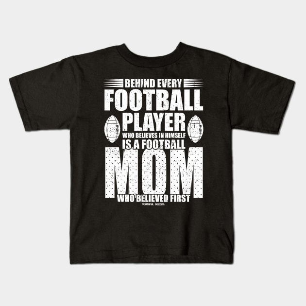 Behind Every Football Player Is A Football Mom Kids T-Shirt by YouthfulGeezer